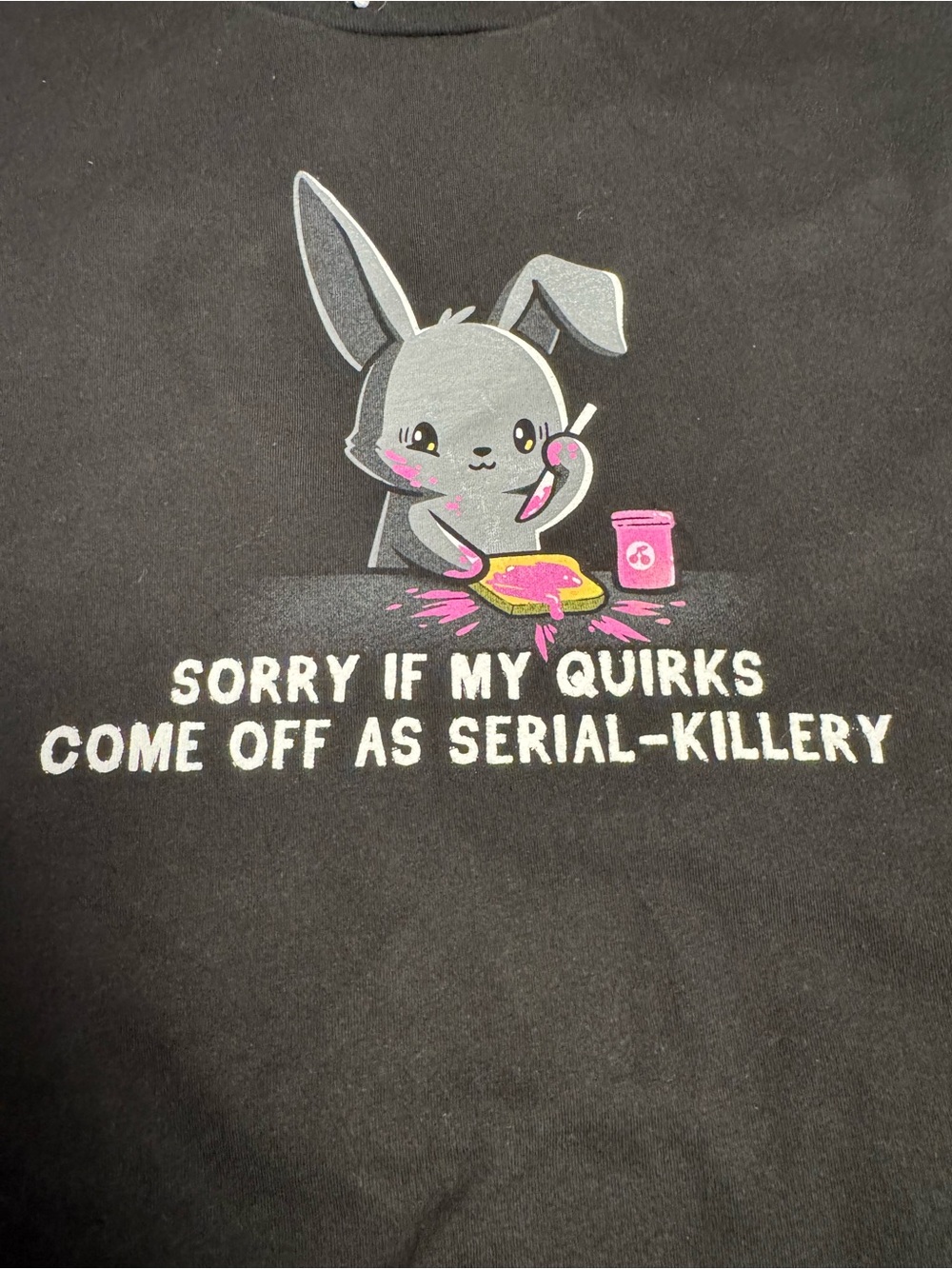 Those are SOME quirks! Black XL tee featuring cute bunny serial unaliver